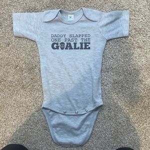 “Daddy slapped one past the goalie” onesie perfect for baby announcements